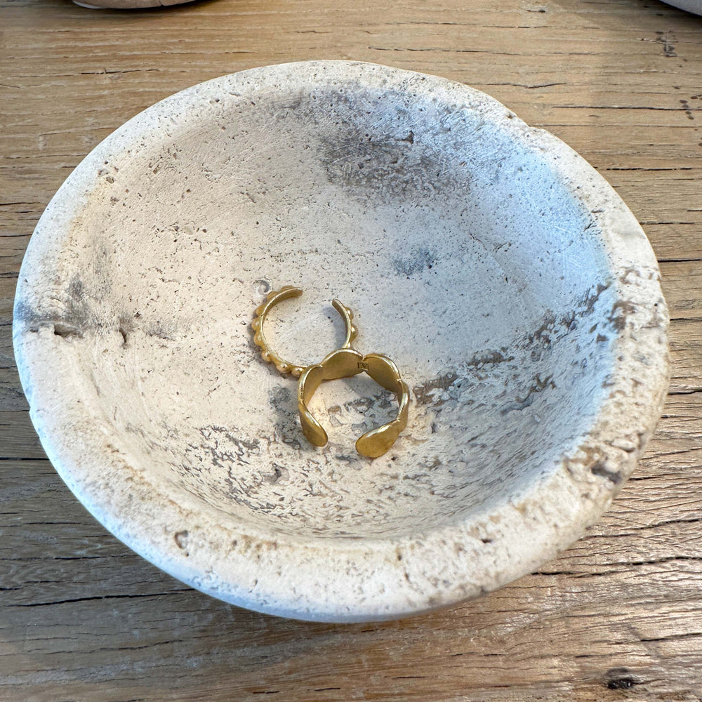 Small Travertine Marble Bowl with two gold rings inside.