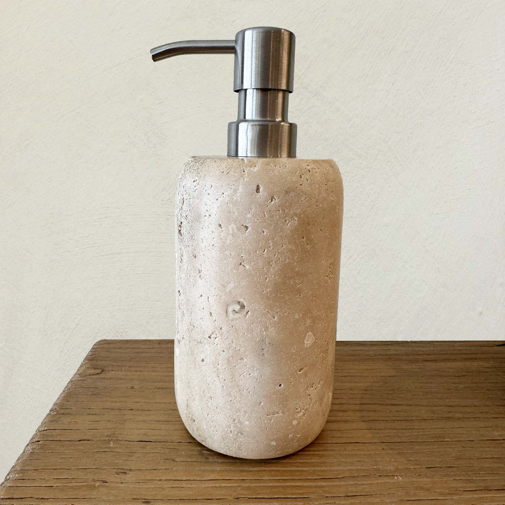 Travertine Marble refillable soap or lotion dispenser.