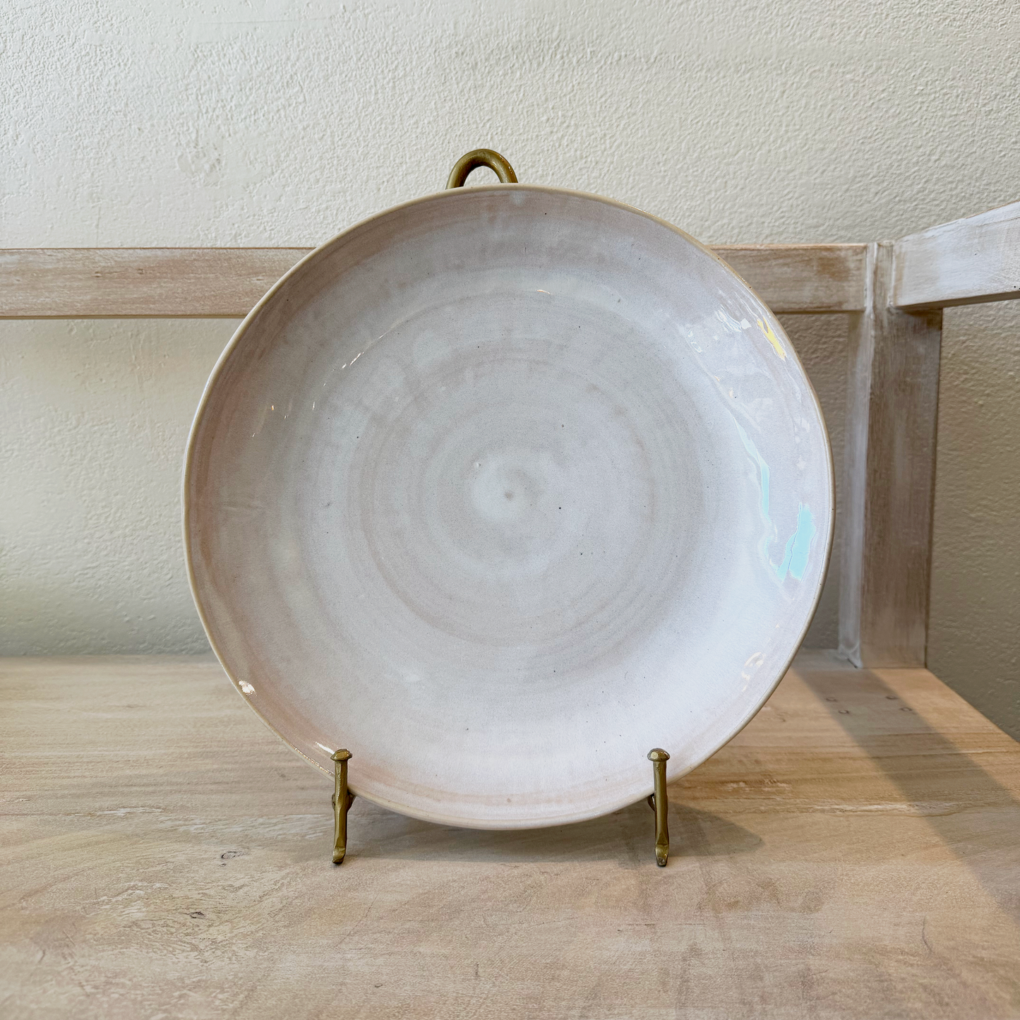 Plater on a display shelf