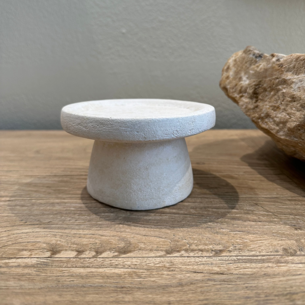 Ceramic Pedestal for a candle on a wooden console