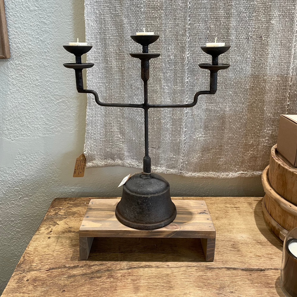 Aged Iron Candelabra on teak table