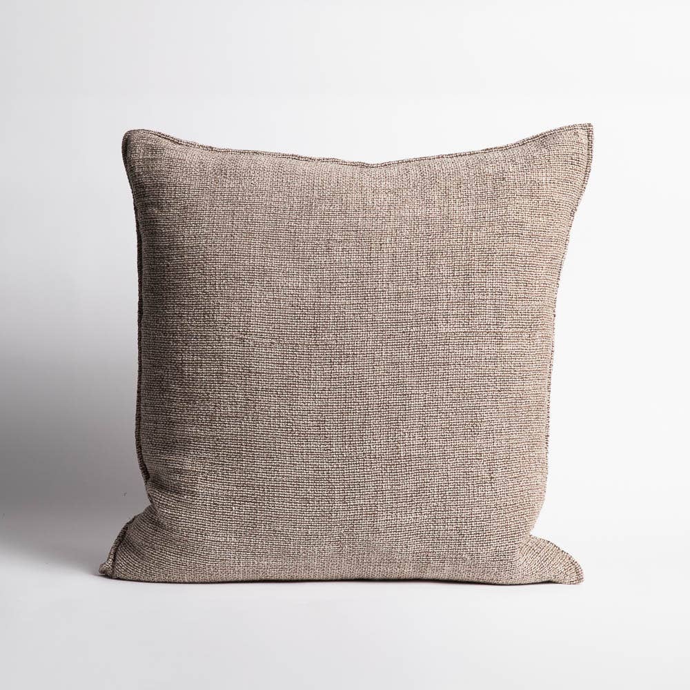 Textured brown pillow on a light gray background