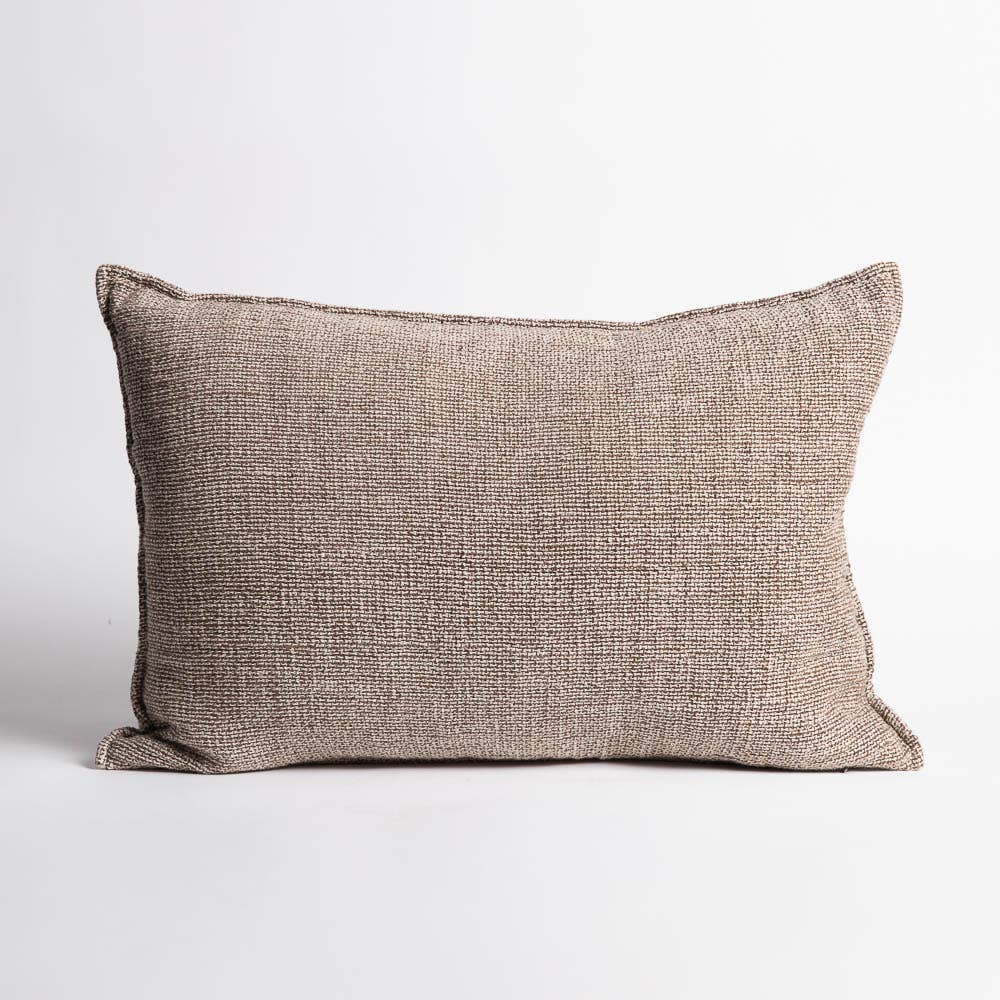 
                  
                    Textured brown pillow on a light gray background
                  
                
