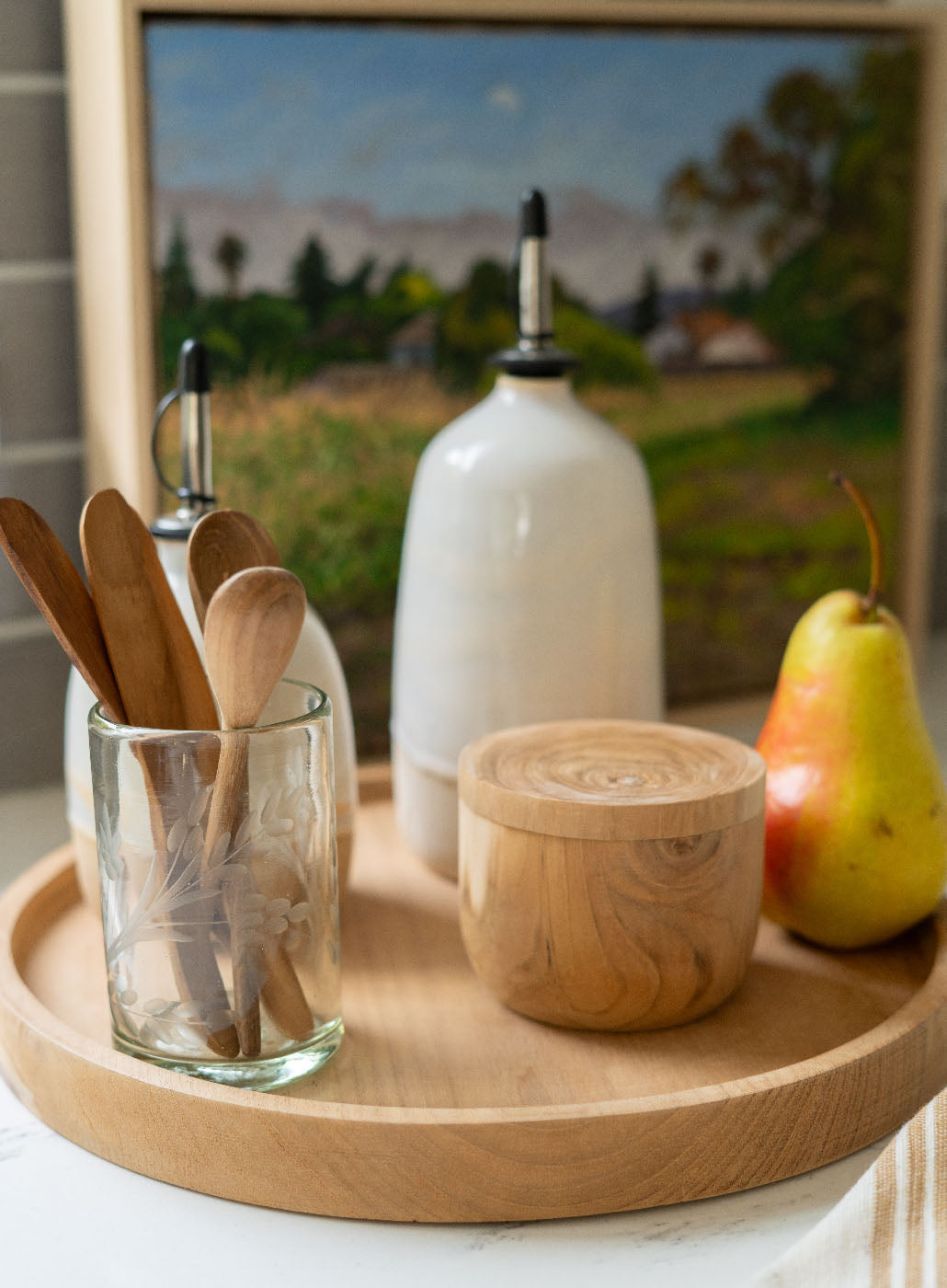 
                  
                    A slightly out of focused image showcasing the olive oil dispenser in a kitchen 
                  
                