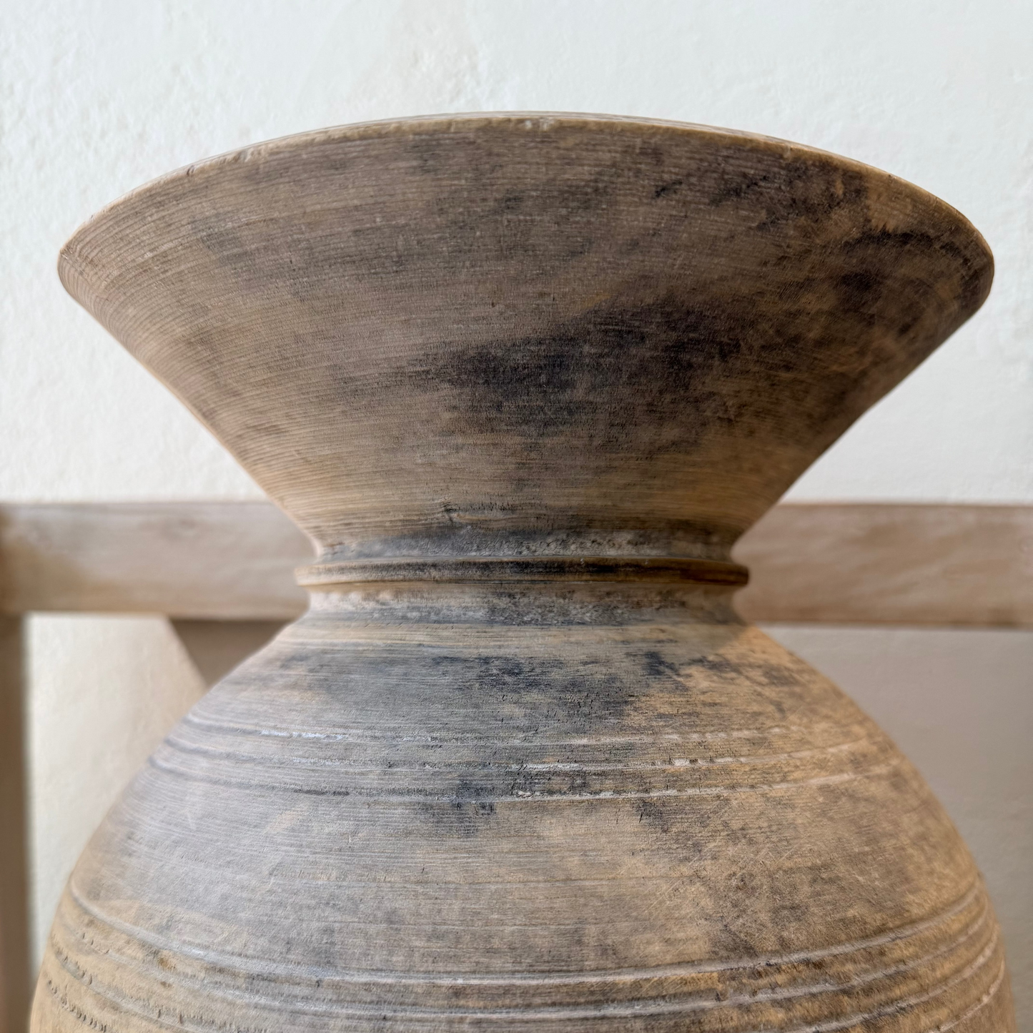 
                  
                    Close-up of a textured ceramic vase on a white background
                  
                
