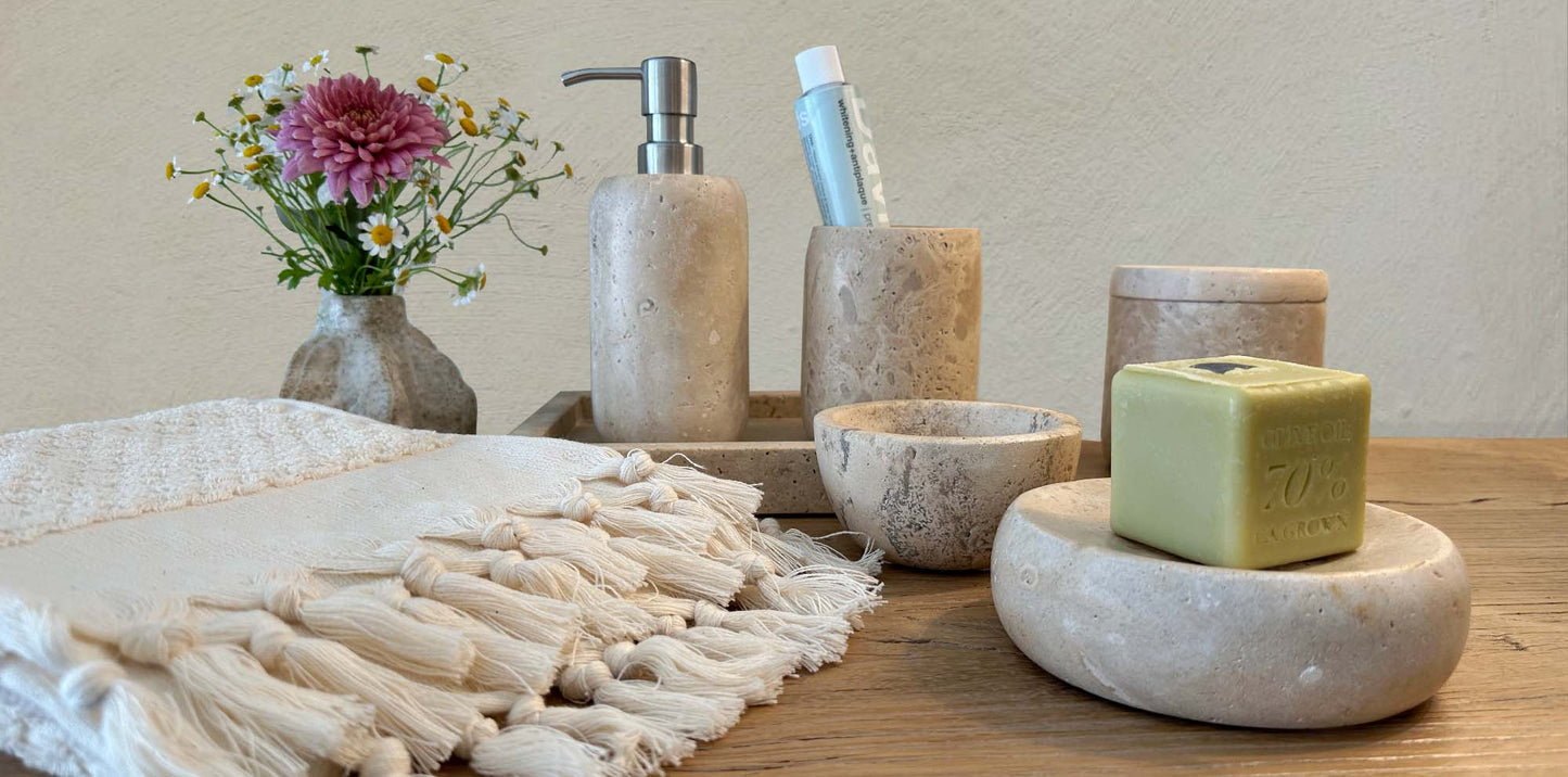 Travertine Marble Bath Vanity Set and white hand towel.