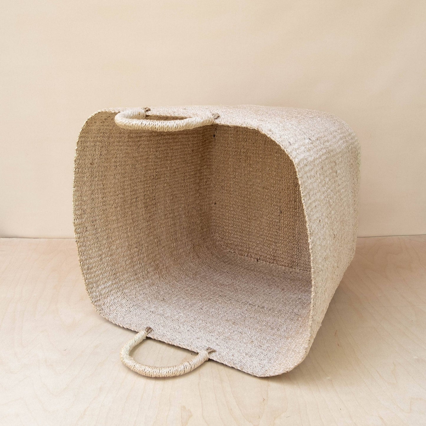 
                  
                    Nula basket on its side showing the inside details of the basket
                  
                