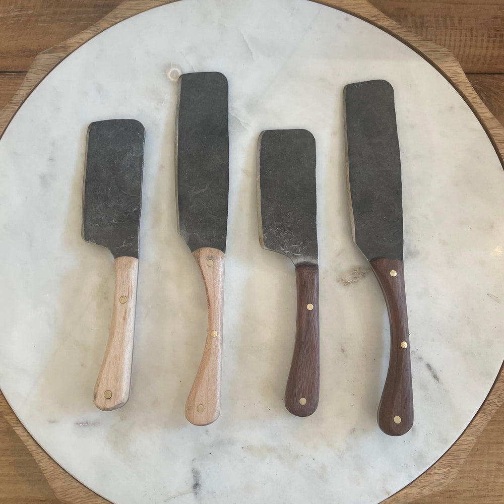 Four chess knifes on a marble platter
