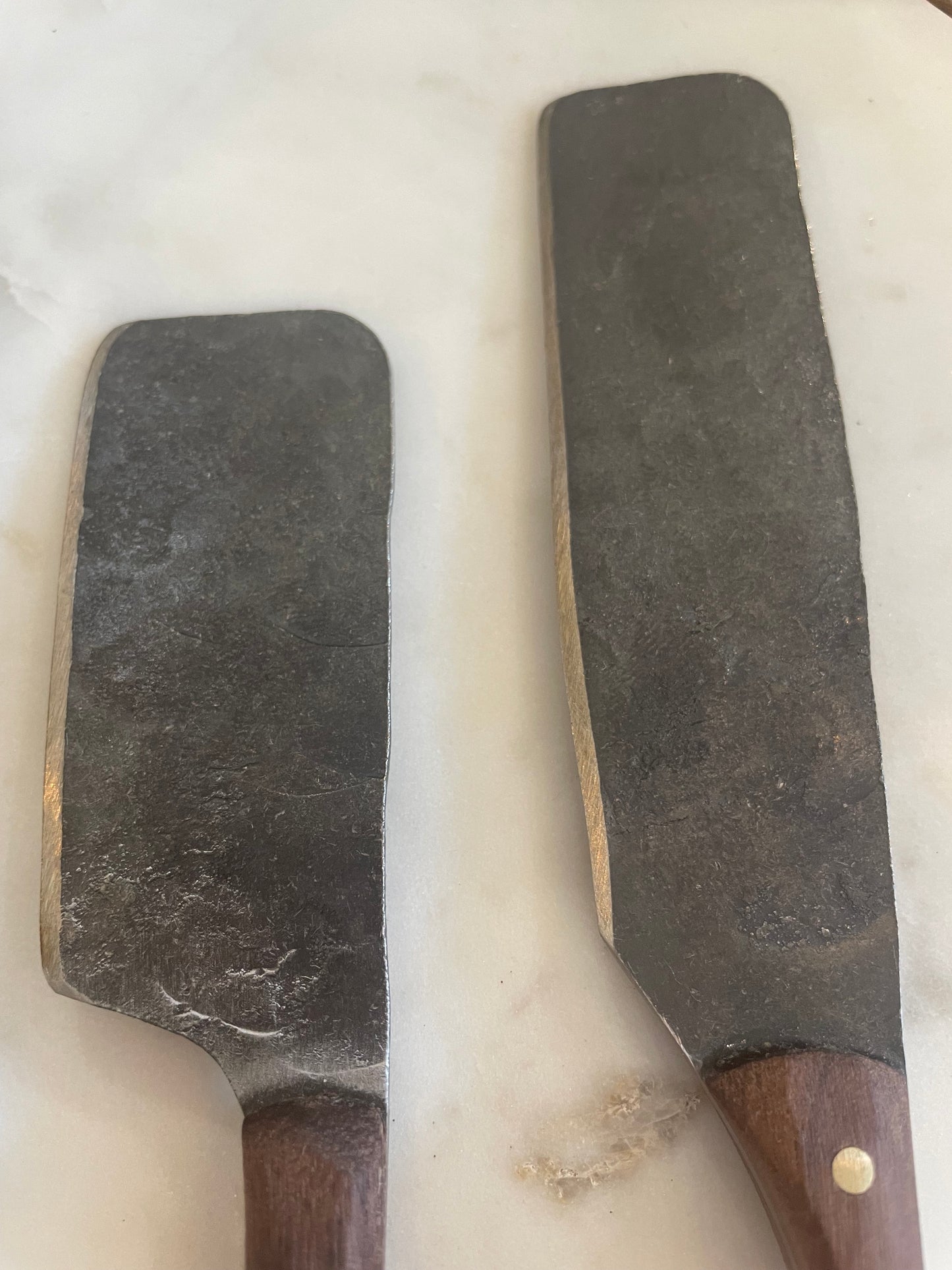 
                  
                    Detail of cheese knife blade showing hand made markings
                  
                