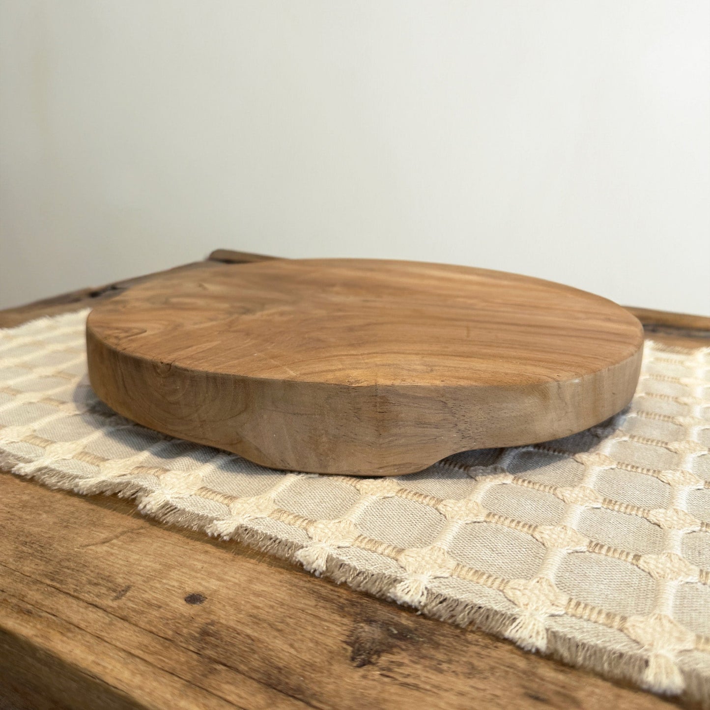 Teak wood stand on table.