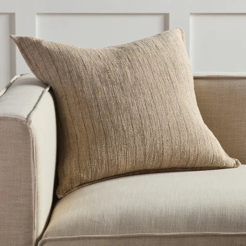 Luster Yarn Pillow resting on the back of the sofa