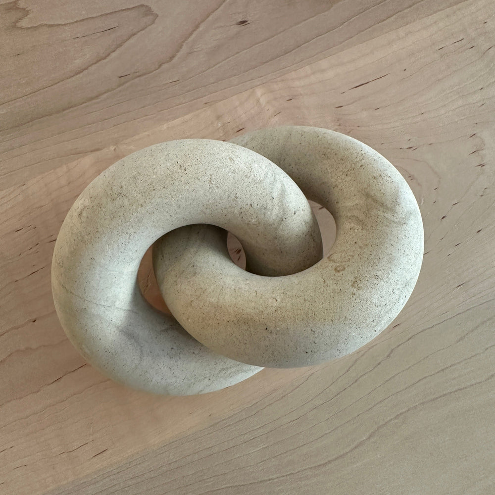 Decorative Sandstone Knot on a wooden table
