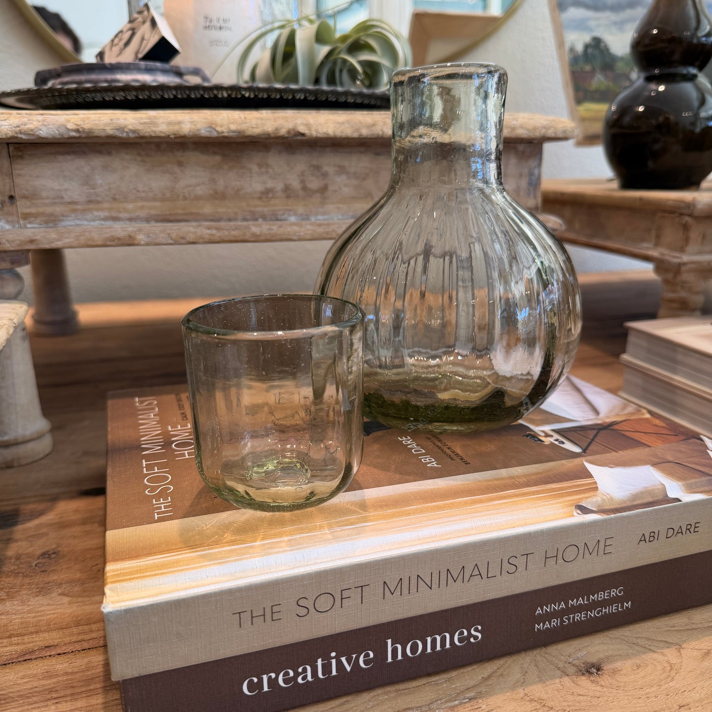 glass carafe on two books