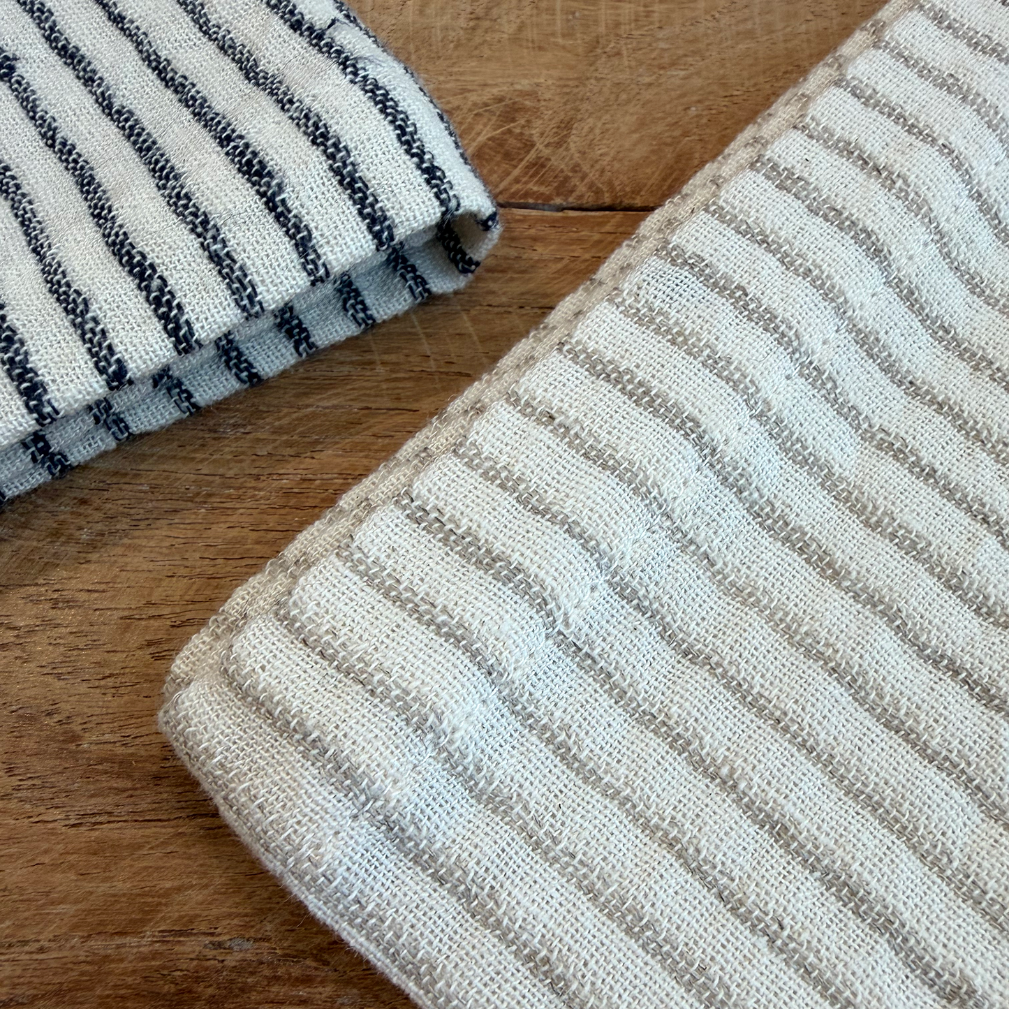 Close-up of striped fabric on a wooden surface